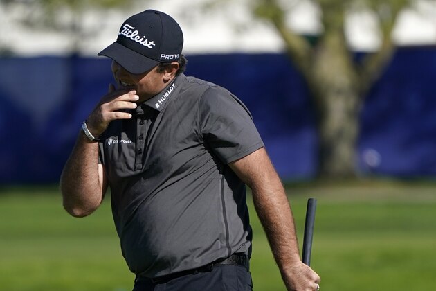 Patrick Reed reacts after missing a putt on the 16th hole of the South Course during the third round of the Farmers Insurance Open golf tournament at Torrey Pines, Saturday, Jan. 30, 2021, in San Diego. (AP Photo/Gregory Bull)