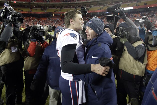 New England Patriots quarterback Tom Brady, left, and character coach Jack Easterby, right, following overtime of the AFC Championship NFL football game, Sunday, Jan. 20, 2019, in Kansas City, Mo. (AP Photo/Elise Amendola)