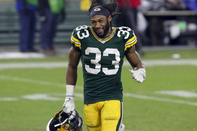 Green Bay Packers' Aaron Jones runs off the field after an NFL divisional playoff football game against the Los Angeles Rams Saturday, Jan. 16, 2021, in Green Bay, Wis. The Packers defeated the Rams 32-18 to advance to the NFC championship game. (AP Photo/Mike Roemer)
