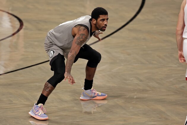 Brooklyn Nets guard Kyrie Irving (11) defends during the second half of an NBA basketball game against the Miami Heat, Monday, Jan. 25, 2021, in New York. (AP Photo/Adam Hunger)