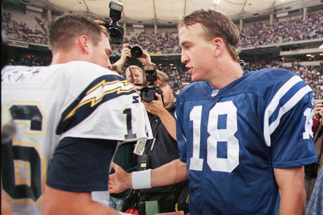 Indianapolis Colts quarterback Peyton Manning, right, meets with San Diego Chargers quarterback Ryan Leaf after the Colts defeated the Charges 17-12 in Indianapolis, Sunday, Oct. 4, 1998. The win was Manning's first win in the NFL. (AP Photo/Michael Conroy) Indianapolis Colts quarterback Peyton Manning, right, meets with San Diego Chargers quarterback Ryan Leaf after the Colts defeated the Charges 17-12 in Indianapolis, Sunday, Oct. 4, 1998. The win was Manning's first win in the NFL. (AP Photo/Michael Conroy)