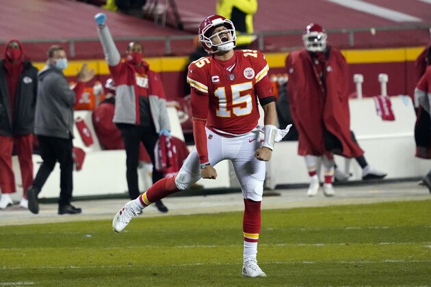 Kansas City Chiefs quarterback Patrick Mahomes celebrates after throwing a 5-yard touchdown pass to tight end Travis Kelce during the second half of the AFC championship NFL football game against the Buffalo Bills, Sunday, Jan. 24, 2021, in Kansas City, Mo. (AP Photo/Jeff Roberson)
