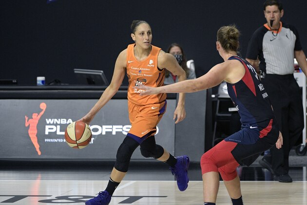 Phoenix Mercury guard Diana Taurasi (3), left, sets up a play in front of Washington Mystics guard Emma Meesseman (33) during the second half of a WNBA basketball first round playoff game, Tuesday, Sept. 15, 2020, in Bradenton, Fla. (AP Photo/Phelan M. Ebenhack)