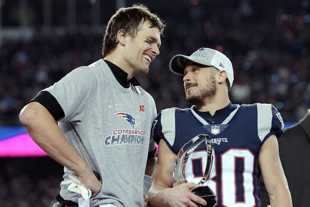 New England Patriots quarterback Tom Brady, left, speaks to wide receiver Danny Amendola (80) after winning the AFC championship NFL football game against the Jacksonville Jaguars, Sunday, Jan. 21, 2018, in Foxborough, Mass. The Patriots won 24-20. (AP Photo/David J. Phillip)