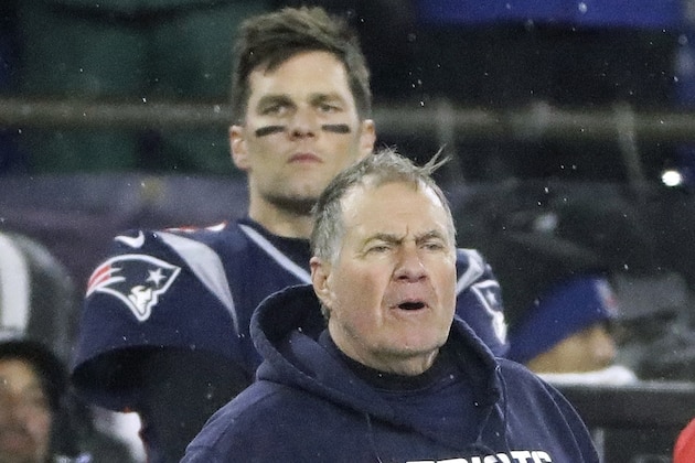 New England Patriots head coach Bill Belichick, front, and quarterback Tom Brady watch the final minute of an NFL wild-card playoff football game loss to the Tennessee Titans, Saturday, Jan. 4, 2020, in Foxborough, Mass. (AP Photo/Steven Senne)