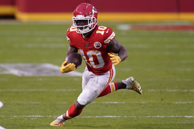 Kansas City Chiefs wide receiver Tyreek Hill runs up field after catching a pass during the second half of an NFL divisional round football game against the Cleveland Browns, Sunday, Jan. 17, 2021, in Kansas City. The Chiefs won 22-17. (AP Photo/Charlie Riedel)