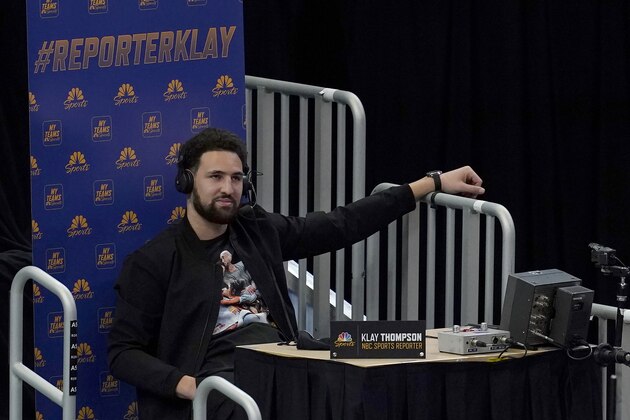 Injured Golden State Warriors guard Klay Thompson speaks as a guest analyst on a television broadcast during the second half of the team's NBA basketball game against the Detroit Pistons in San Francisco, Saturday, Jan. 30, 2021. (AP Photo/Jeff Chiu)