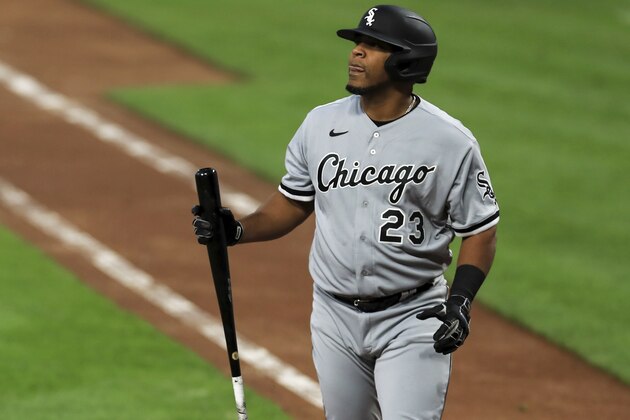 FILE - In this Sept. 18, 2020, file photo, Chicago White Sox' Edwin Encarnacion reacts during a baseball game against the Cincinnati Reds in Cincinnati. About 50 players would be eligible for free agency if their options are declined by Sunday, among them the White Sox designated hitter Edwin Encarnacion. (AP Photo/Aaron Doster, File)