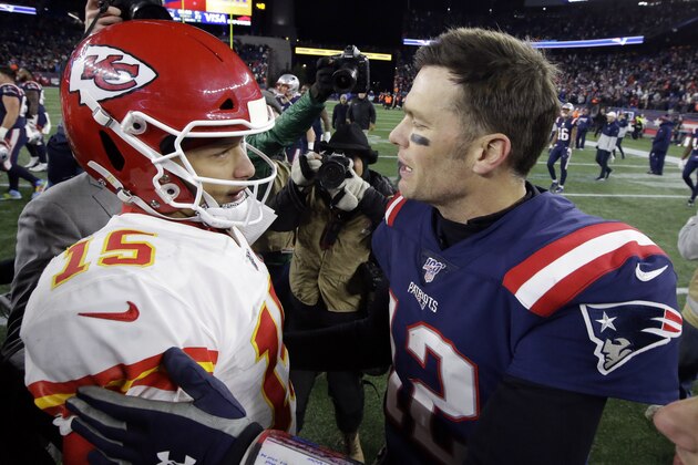 Kansas City Chiefs quarterback Patrick Mahomes, left, and New England Patriots quarterback Tom Brady speak at midfield after an NFL football game, Sunday, Dec. 8, 2019, in Foxborough, Mass. (AP Photo/Steven Senne)