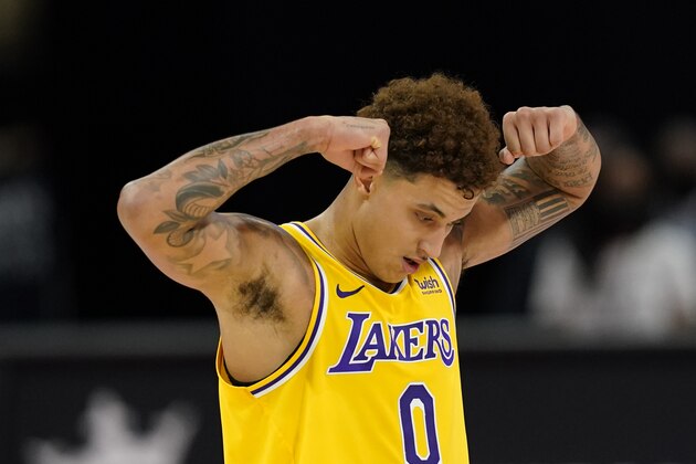 Los Angeles Lakers forward Kyle Kuzma reacts after a play during the second half of an NBA basketball game against the Detroit Pistons, Thursday, Jan. 28, 2021, in Detroit. (AP Photo/Carlos Osorio)