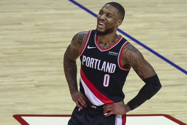 Portland Trail Blazers guard Damian Lillard (0) reacts after a play during the fourth quarter of an NBA basketball game against the Houston Rockets, Thursday, Jan. 28, 2021, in Houston. (Troy Taormina/Pool Photo via AP)