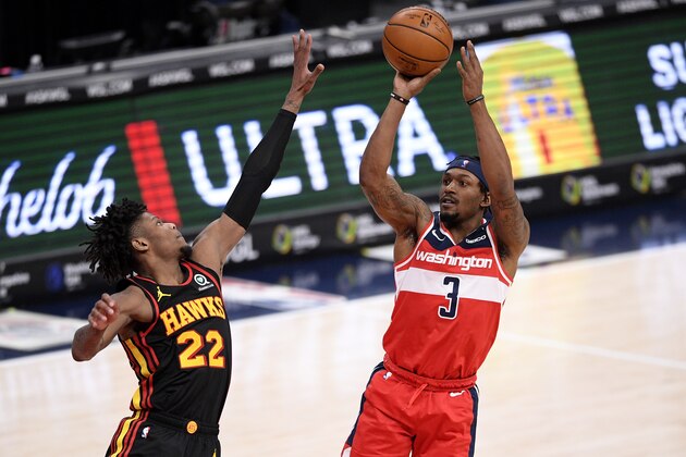Washington Wizards guard Bradley Beal (3) shoots against Atlanta Hawks guard Cam Reddish (22) during the second half of an NBA basketball game, Friday, Jan. 29, 2021, in Washington. (AP Photo/Nick Wass)