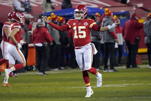 Kansas City Chiefs quarterback Patrick Mahomes celebrates after throwing a 5-yard touchdown pass to tight end Travis Kelce during the second half of the AFC championship NFL football game against the Buffalo Bills, Sunday, Jan. 24, 2021, in Kansas City, Mo. (AP Photo/Jeff Roberson)