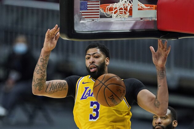 Los Angeles Lakers' Anthony Davis dunks the ball against the Cleveland Cavaliers in the second half of an NBA basketball game, Monday, Jan. 25, 2021, in Cleveland. (AP Photo/Tony Dejak)