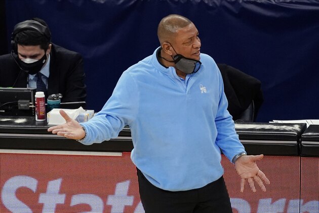 Philadelphia 76ers coach Doc Rivers questions a call during the first half of the team's NBA basketball game against the Minnesota Timberwolves, Friday, Jan. 29, 2021, in Minneapolis. (AP Photo/Jim Mone)