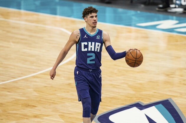 Charlotte Hornets guard LaMelo Ball (2) brings the ball up court against the Milwaukee Bucks during an NBA basketball game in Charlotte, N.C., Saturday, Jan. 30, 2021. (AP Photo/Jacob Kupferman)