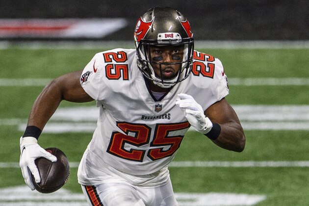 Tampa Bay Buccaneers running back LeSean McCoy (25) runs the ball during the first half of an NFL football game against the Atlanta Falcons, Sunday, Dec. 20, 2020, in Atlanta. The Tampa Bay Buccaneers won 31-27. (AP Photo/Danny Karnik)