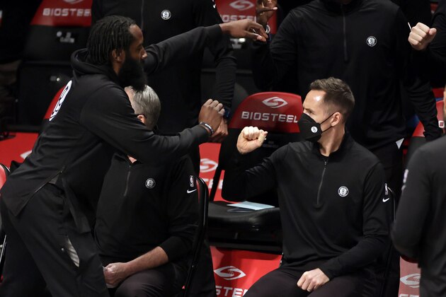 Brooklyn Nets guard James Harden bumps fists with head coach Steve Nash before an NBA basketball game against the Miami Heat, Monday, Jan. 25, 2021, in New York. The Nets won 98-85. (AP Photo/Adam Hunger)