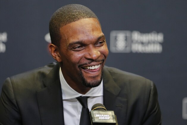 Former Miami Heat player Chris Bosh speaks at a press conference before the team's retirement of his jersey at halftime of an NBA game between the Heat and the Orlando Magic, Tuesday, March 26, 2019, in Miami. Bosh played 13 seasons, the first seven in Toronto and the last six in Miami. He averaged 19.2 points and 8.5 rebounds, was an All-Star 11 times and won two championships.  (AP Photo/Joe Skipper)