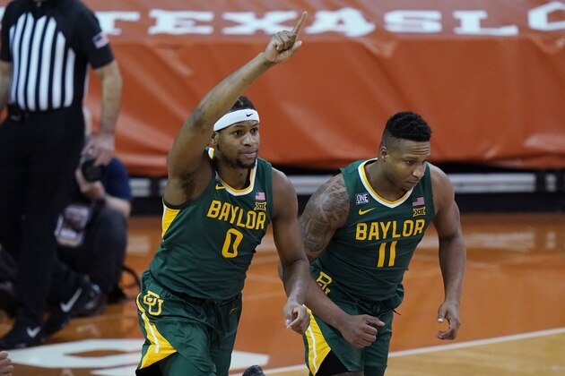 Baylor forward Flo Thamba (0) celebrates a score against Texas during the first half of an NCAA college basketball game Tuesday, Feb. 2, 2021, in Austin, Texas. (AP Photo/Eric Gay)