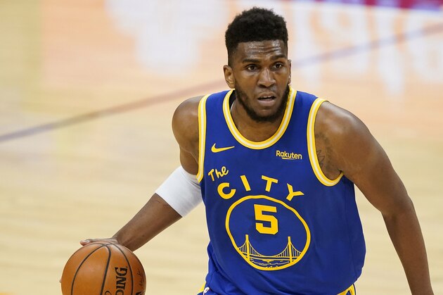 Golden State Warriors forward Kevon Looney (5) against the Phoenix Suns during the first half of an NBA basketball game, Thursday, Jan. 28, 2021, in Phoenix. (AP Photo/Matt York)