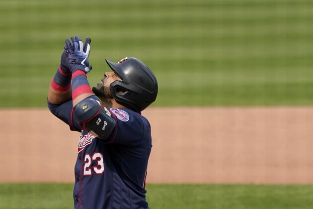 Minnesota Twins' Nelson Cruz celebrates after hitting a solo home run during the fifth inning in the first game of a baseball doubleheader against the St. Louis Cardinals Tuesday, Sept. 8, 2020, in St. Louis. (AP Photo/Jeff Roberson)