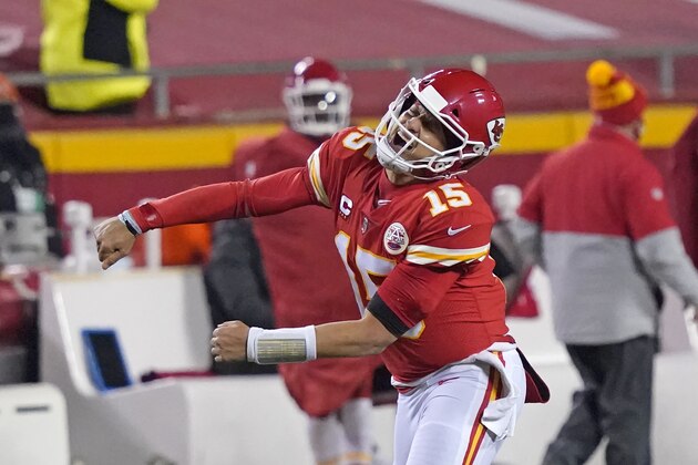 Kansas City Chiefs quarterback Patrick Mahomes celebrates after throwing a 5-yard touchdown pass to tight end Travis Kelce during the second half of the AFC championship NFL football game against the Buffalo Bills, Sunday, Jan. 24, 2021, in Kansas City, Mo. (AP Photo/Jeff Roberson)