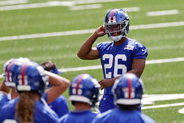 New York Giants running back Saquon Barkley (26) walks to the bench during a practice at the NFL football team's training camp in East Rutherford, N.J., Wednesday, Aug. 26, 2020. (AP Photo/Adam Hunger)