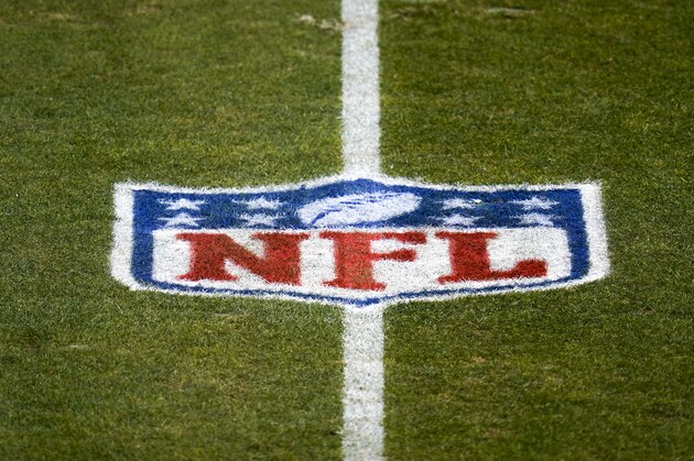 The NFL logo is shown on the field before a game between the Denver Broncos and the Las Vegas Raiders, Sunday, Jan. 3, 2021, in Denver. (AP Photo/Jack Dempsey)