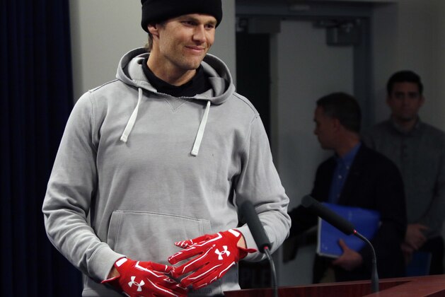 New England Patriots quarterback Tom Brady wears gloves as he arrives to speak to the media, Friday, Jan. 19, 2018, in Foxborough, Mass. The Patriots host the Jacksonville Jaguars in the AFC championship on Sunday in Foxborough.(AP Photo/Bill Sikes)