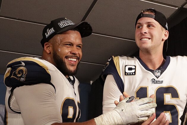 Los Angeles Rams defensive end Aaron Donald (99) Los Angeles Rams nose tackle Ndamukong Suh (93) and Los Angeles Rams quarterback Jared Goff (16) after overtime of the NFL football NFC championship game against the New Orleans Saints, Sunday, Jan. 20, 2019, in New Orleans. The Rams won 26-23.(AP Photo/David J. Phillip)