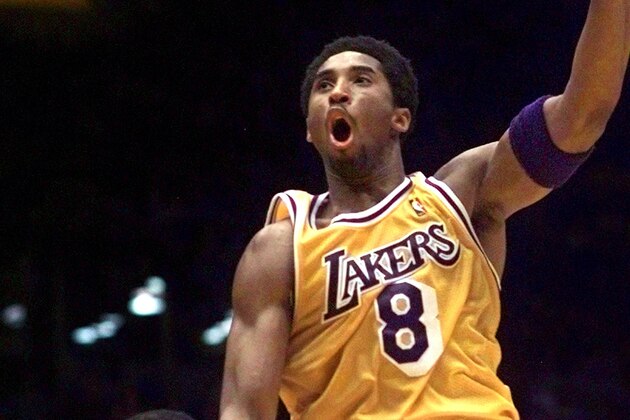 FILE - In this Marcy 28, 1999, file photo, Los Angeles Lakers' Kobe Bryant shoots over New York Knicks' Patrick Ewing during the first half of an NBA basketball game in Inglewood, Calif. The Lakers announced Tuesday, Sept. 12, 2017,  that they will retire Bryant’s No. 8 and No. 24 in a ceremony Dec. 18 during their game against Golden State. Bryant wore No. 8 from 1996 to 2006, when he switched to No. 24 for the remainder of his 20-year career with the Lakers. He will be the 10th player honored by the Lakers with a jersey retirement, and the first to have two retired numbers. (AP Photo/Mark J. Terrill, File)