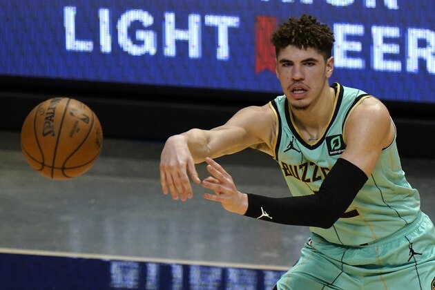Charlotte Hornets guard LaMelo Ball passes the ball during the first half of an NBA basketball game Miami Heat, Monday, Feb. 1, 2021, in Miami. (AP Photo/Lynne Sladky) Charlotte Hornets guard LaMelo Ball passes the ball during the first half of an NBA basketball game Miami Heat, Monday, Feb. 1, 2021, in Miami. (AP Photo/Lynne Sladky)