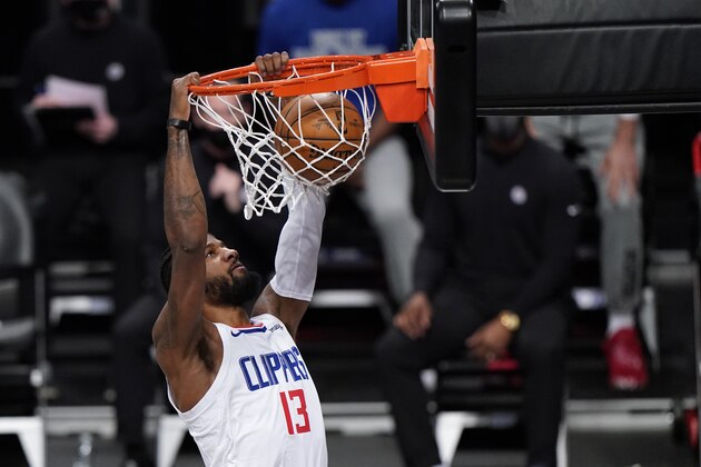 Los Angeles Clippers guard Paul George dunks during the first quarter of the team's NBA basketball game against the Brooklyn Nets, Tuesday, Feb. 2, 2021, in New York. (AP Photo/Kathy Willens)