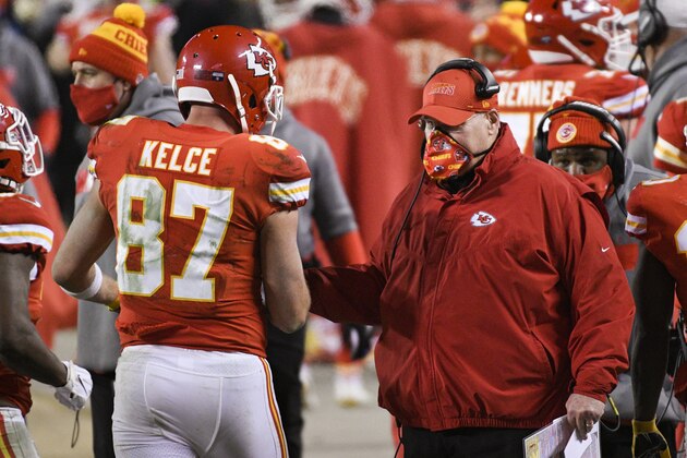 Kansas City Chiefs tight end Travis Kelce is congratulated by Kansas City Chiefs head coach Andy Reid after scoring a touchdown during the second half of the NFL AFC championship football game against the Buffalo Bills, Sunday, Jan. 24, 2021, in Kansas City, Mo. (AP Photo/Reed Hoffmann)