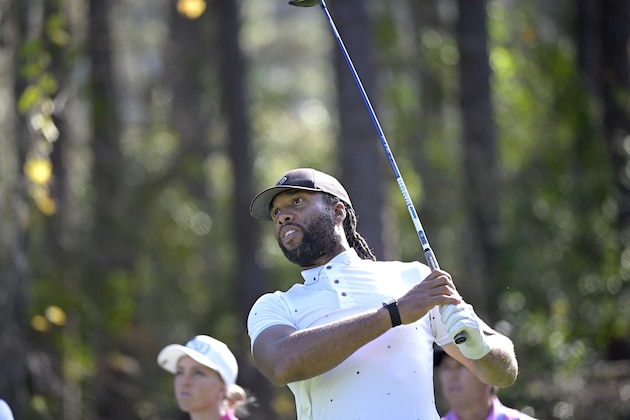 NFL football player Larry Fitzgerald watches his tee shot on the second hole during the final round of the Tournament of Champions LPGA golf tournament, Sunday, Jan. 24, 2021, in Lake Buena Vista, Fla. (AP Photo/Phelan M. Ebenhack)