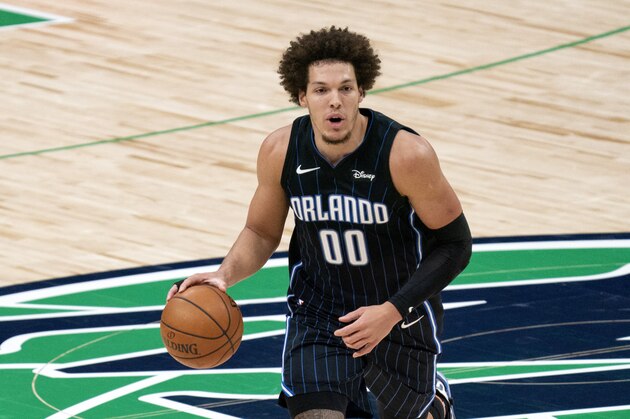 Orlando Magic forward Aaron Gordon (00) brings the ball up the court during an NBA basketball game against the Dallas Mavericks, Saturday, Jan. 9, 2021, in Dallas. Dallas won 112-98. (AP Photo/Jeffrey McWhorter)