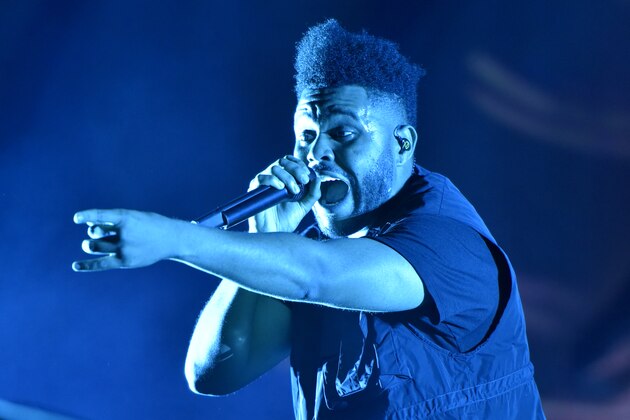 FILE - The Weeknd performs on day three at Lollapalooza in Chicago on Aug 4, 2018.  The NFL, Pepsi and Roc Nation announced Thursday, Nov. 12 that the three-time Grammy winner will perform at the 2021 Pepsi Super Bowl Halftime Show on Feb. 7 at Raymond James Stadium in Tampa, Florida. (Photo by Rob Grabowski/Invision/AP, File)