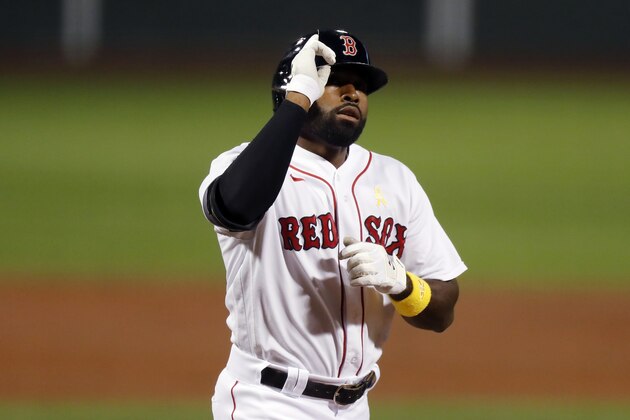 Boston Red Sox's Jackie Bradley Jr. celebrates his two-run home run during the second inning of a baseball game against the Toronto Blue Jays, Saturday, Sept. 5, 2020, in Boston. (AP Photo/Michael Dwyer)