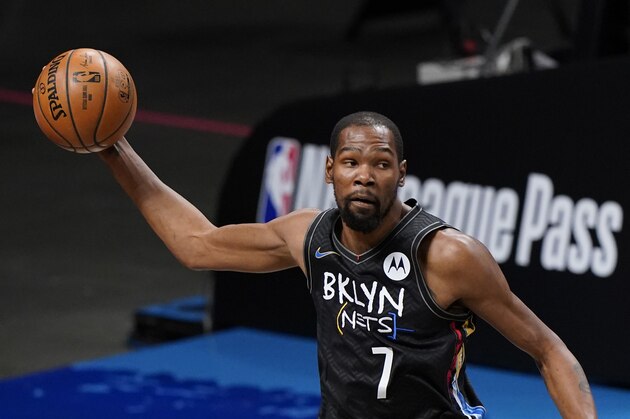 Brooklyn Nets forward Kevin Durant (7) looks to pass during pregame warmups before an NBA basketball game against the Los Angeles Clippers, Tuesday, Feb. 2, 2021, in New York. (AP Photo/Kathy Willens)