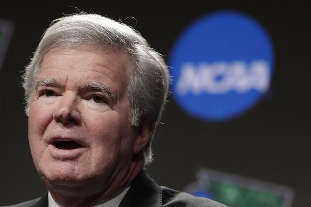 FILE - In this April 4, 2019, file photo, NCAA President Mark Emmert answers questions during a news conference at the Final Four college basketball tournament in Minneapolis. The NCAA will now permit elite athletes to be paid for training expenses by the U.S. Olympic Committee and other national governing bodies. The Division I Council adopted the legislation Wednesday, Jan. 22, 2020, at the NCAA convention and it is effective immediately. (AP Photo/Matt York, File)