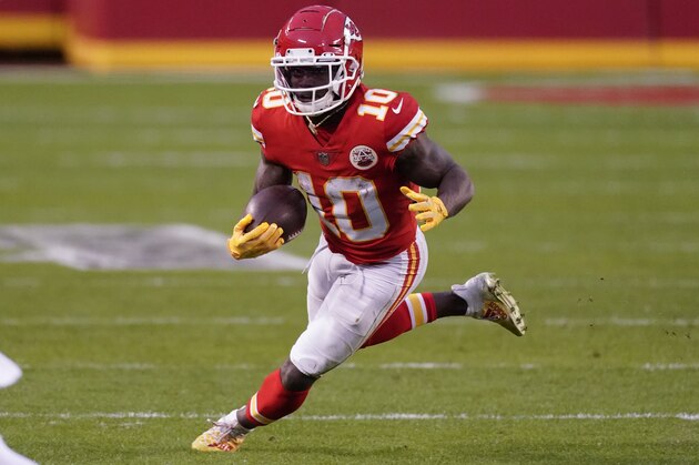 Kansas City Chiefs wide receiver Tyreek Hill runs up field after catching a pass during the second half of an NFL divisional round football game against the Cleveland Browns, Sunday, Jan. 17, 2021, in Kansas City. The Chiefs won 22-17. (AP Photo/Charlie Riedel)