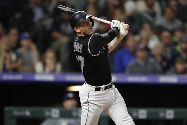 Colorado Rockies' Trevor Story follows the flight of his solo walkoff home run off Milwaukee Brewers relief pitcher Matt Albers in the 10th inning of a baseball game Saturday, Sept. 28, 2019, in Denver. (AP Photo/David Zalubowski)
