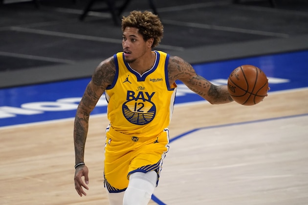 Golden State Warriors' Kelly Oubre Jr. advances the ball during the second half of the team's NBA basketball game against the Dallas Mavericks in Dallas, Thursday, Feb. 4, 2021. (AP Photo/Tony Gutierrez)