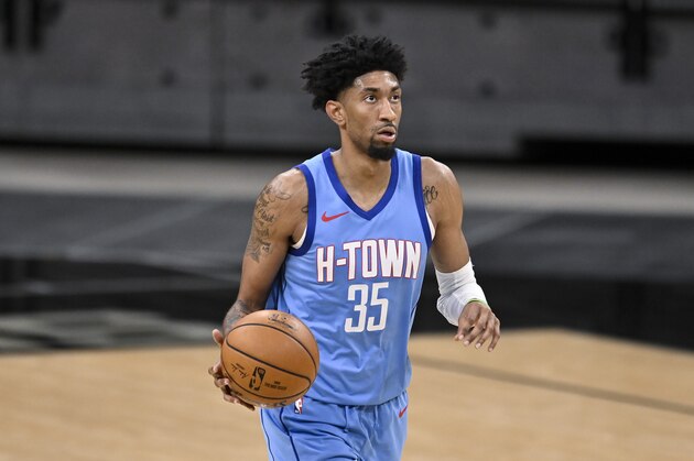 Houston Rockets' Christian Wood runs up the court during the second half of an NBA basketball game against the San Antonio Spurs, Saturday, Jan. 16, 2021, in San Antonio. San Antonio won 103-91. (AP Photo/Darren Abate)
