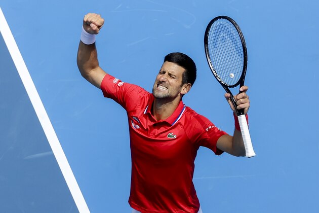 Serbia's Novak Djokovic celebrates after defeating Canada's Denis Shapovalov in their ATP Cup match in Melbourne, Australia, Tuesday, Feb. 2, 2021. (AP Photo/Hamish Blair)