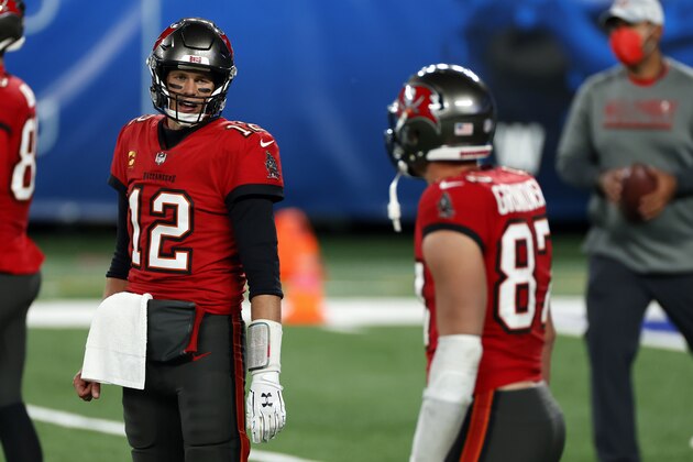 Tampa Bay Buccaneers quarterback Tom Brady (12) and Tampa Bay Buccaneers tight end Rob Gronkowski (87) warm ups before an NFL football game against the New York Giants, Monday, Nov. 2, 2020, in East Rutherford, N.J. (AP Photo/Adam Hunger)