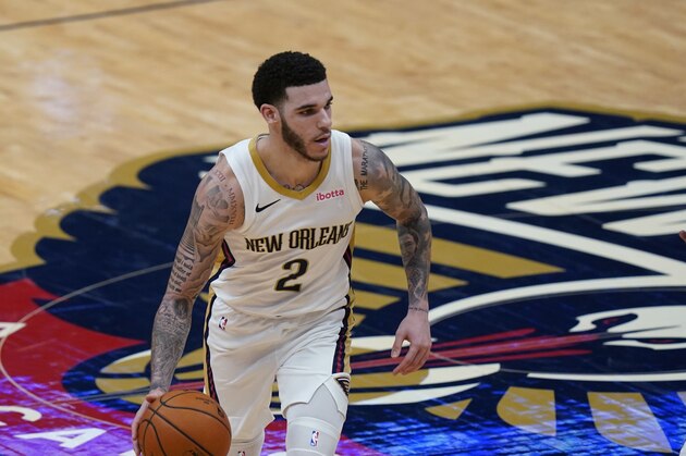 New Orleans Pelicans guard Lonzo Ball (2) dribbles up court in the second half of an NBA basketball game against the Sacramento Kings in New Orleans, Monday, Feb. 1, 2021. (AP Photo/Gerald Herbert)