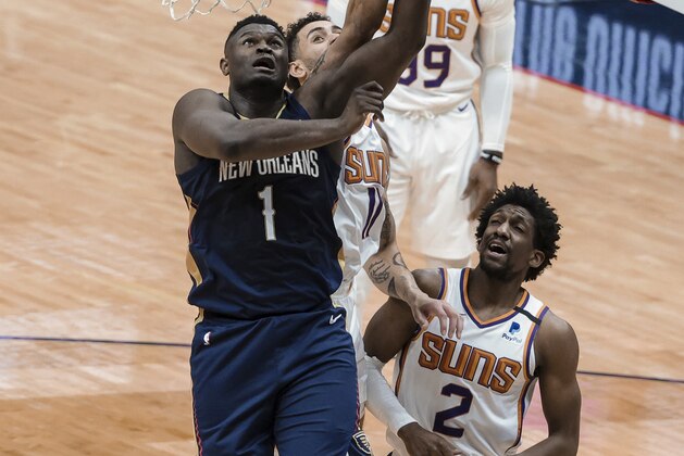 New Orleans Pelicans forward Zion Williamson (1) shoots over Phoenix Suns guard Langston Galloway (2) and forward Frank Kaminsky (8) in the first quarter of an NBA basketball game in New Orleans, Wednesday, Feb. 3, 2021. (AP Photo/Derick Hingle)