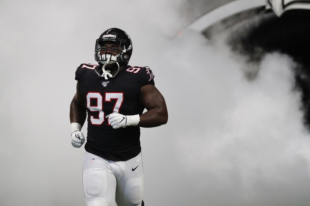Atlanta Falcons defensive tackle Grady Jarrett (97) enters the field before the first half of an NFL football game between the Atlanta Falcons and the Tennessee Titans, Sunday, Sept. 29, 2019, in Atlanta. (AP Photo/John Bazemore)